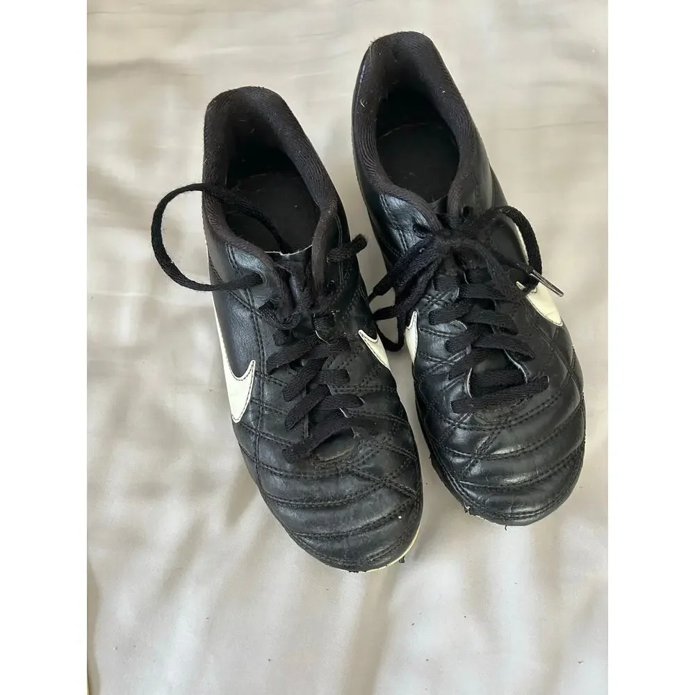 Nike black and white cleats size 2.5